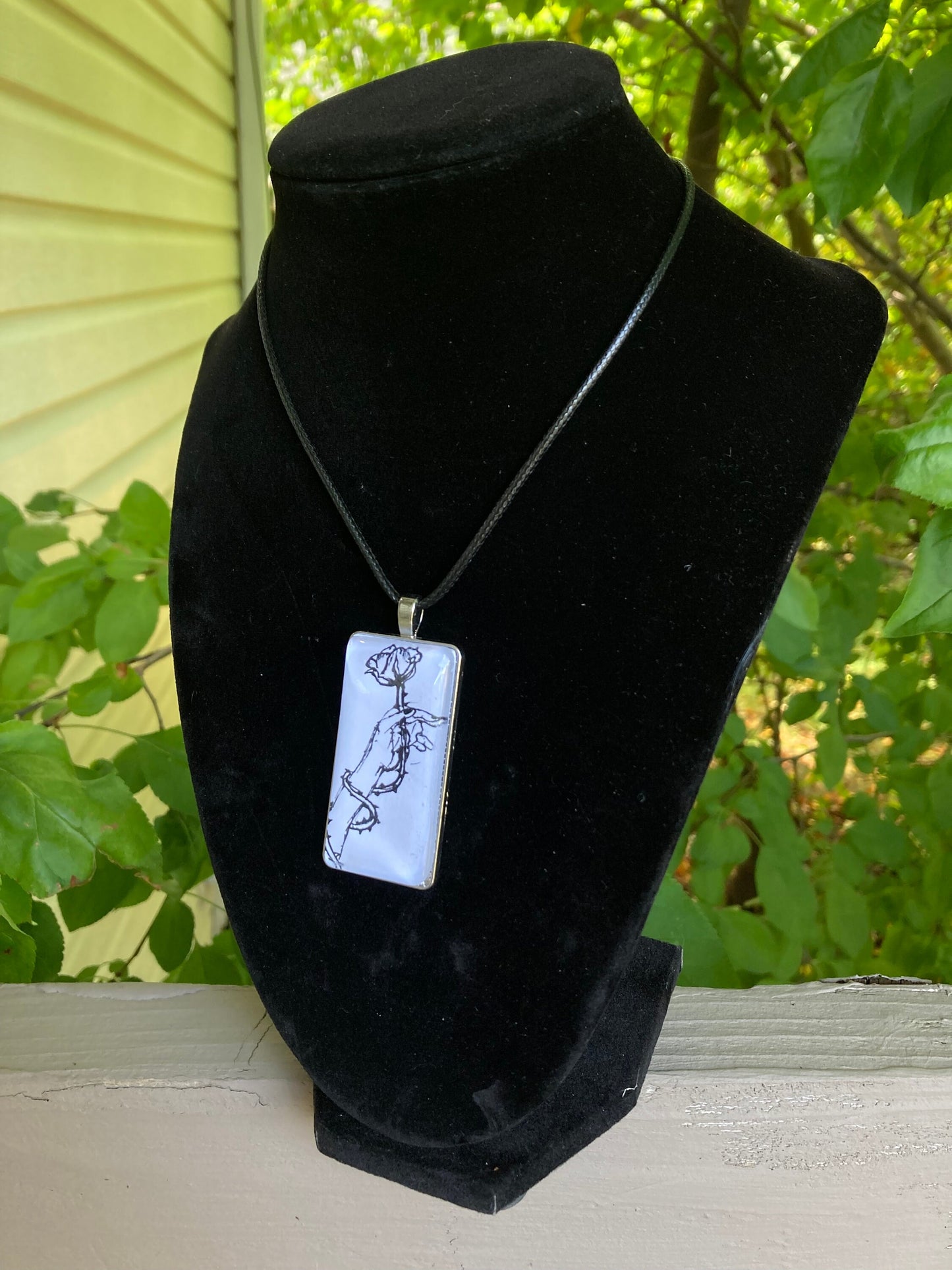 Hand with Rose Pendant